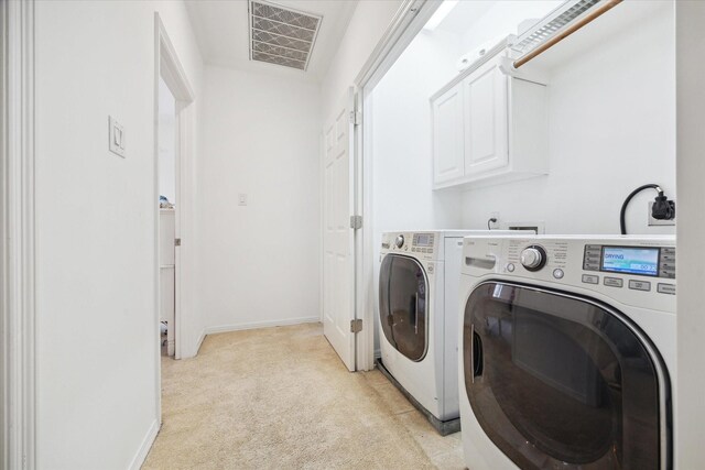 2842 Briarhurst Park, Houston, TX 77057 - clothes washing area featuring light carpet, baseboards, visible vents, independent washer and dryer, and cabinet space