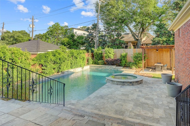 view of swimming pool with a patio area, a fenced backyard, and a pool with connected hot tub