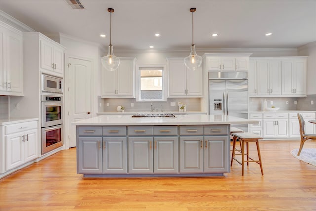 kitchen featuring white cabinets and gray cabinetry
