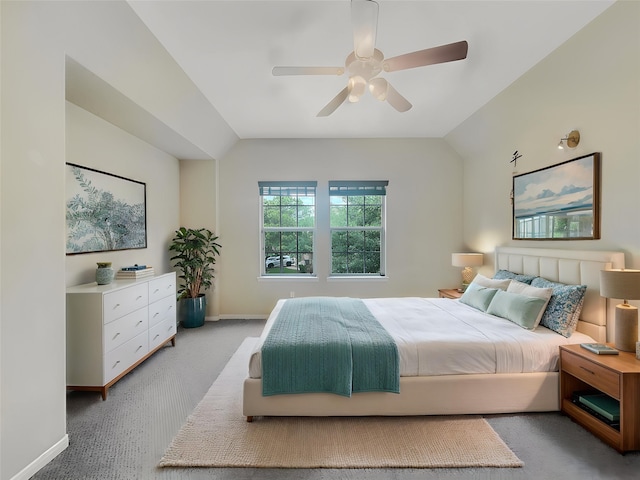 bedroom featuring light colored carpet, baseboards, ceiling fan, and vaulted ceiling