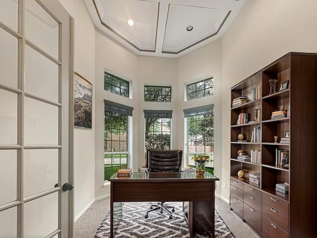 office with baseboards, a high ceiling, light carpet, and coffered ceiling