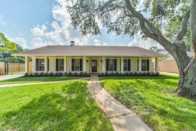 2742 Triway Ln, Houston, TX 77043 - ranch-style home with a chimney, brick siding, fence, and a front yard
