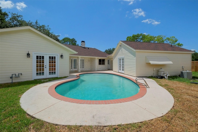 2742 Triway Ln, Houston, TX 77043 - outdoor pool featuring central air condition unit, a lawn, french doors, and a patio area