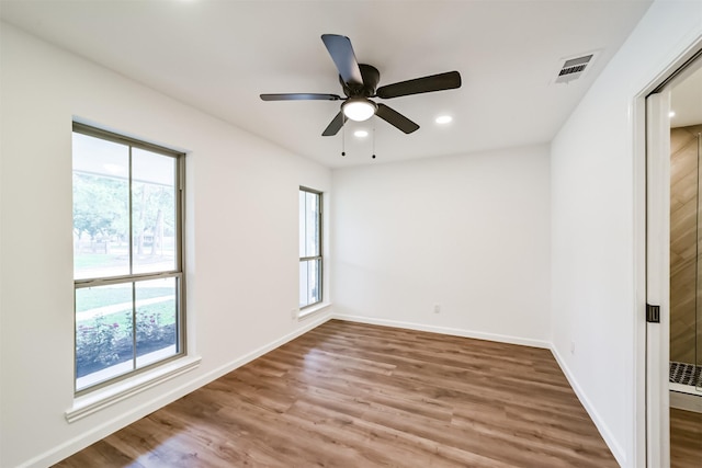 2742 Triway Ln, Houston, TX 77043 - spare room with a ceiling fan, visible vents, a wealth of natural light, and wood finished floors