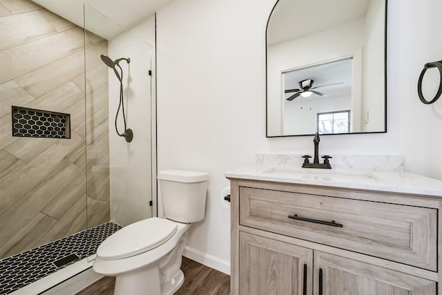 2742 Triway Ln, Houston, TX 77043 - full bath with vanity, wood finished floors, toilet, ceiling fan, and tiled shower