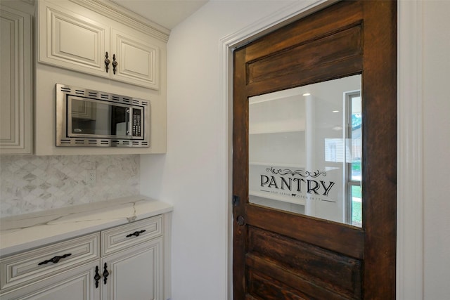 2742 Triway Ln, Houston, TX 77043 - details featuring stainless steel microwave and decorative backsplash