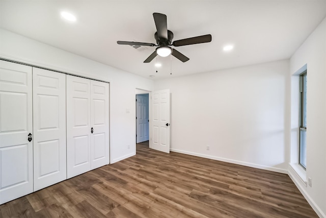 2742 Triway Ln, Houston, TX 77043 - unfurnished bedroom featuring baseboards, a closet, recessed lighting, and wood finished floors