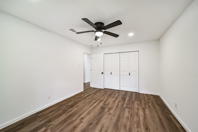 2742 Triway Ln, Houston, TX 77043 - unfurnished bedroom featuring a closet, baseboards, recessed lighting, and dark wood-type flooring