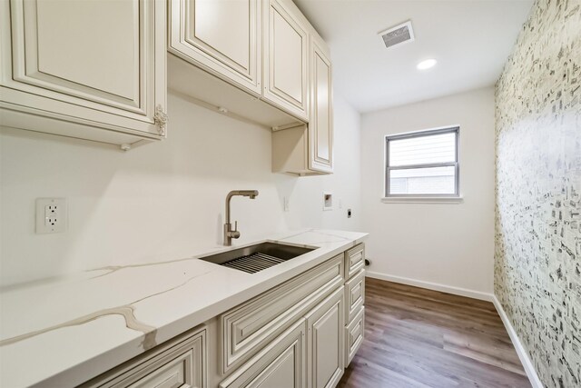 2742 Triway Ln, Houston, TX 77043 - clothes washing area with visible vents, cabinet space, a sink, dark wood-style floors, and hookup for a washing machine