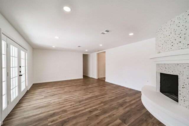 2742 Triway Ln, Houston, TX 77043 - unfurnished living room featuring dark wood-style flooring, a fireplace, recessed lighting, baseboards, and visible vents