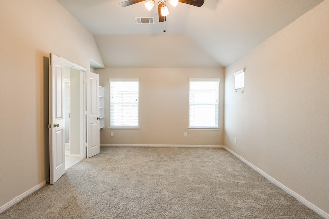2103 Islawild Way, Texas City, TX 77568 - unfurnished bedroom featuring carpet, vaulted ceiling, baseboards, and a ceiling fan