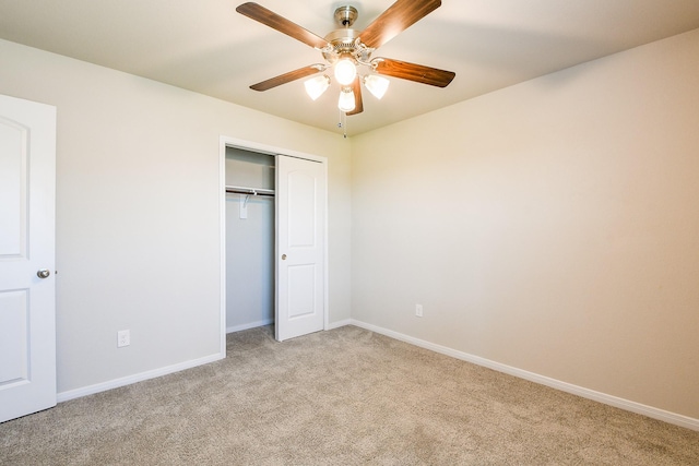 2103 Islawild Way, Texas City, TX 77568 - unfurnished bedroom with carpet, a closet, baseboards, and a ceiling fan