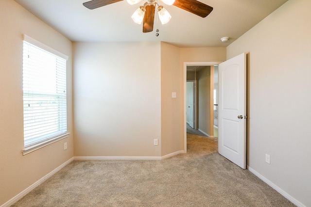 2103 Islawild Way, Texas City, TX 77568 - carpeted empty room with a ceiling fan, plenty of natural light, and baseboards