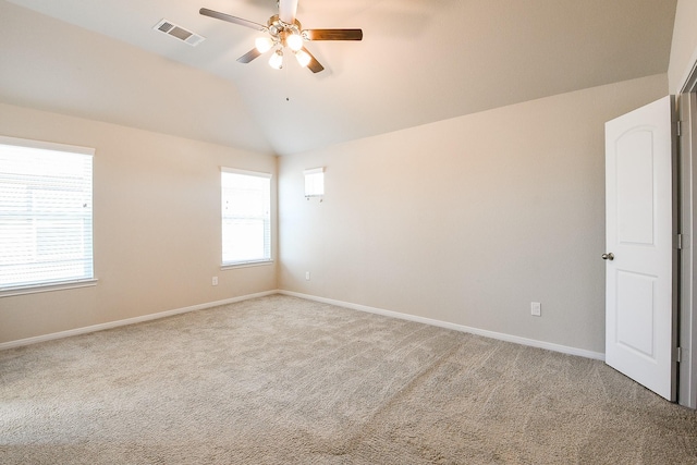 2103 Islawild Way, Texas City, TX 77568 - spare room featuring a ceiling fan, carpet, lofted ceiling, and baseboards