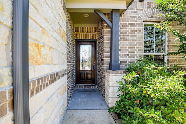 2103 Islawild Way, Texas City, TX 77568 - doorway to property with brick siding