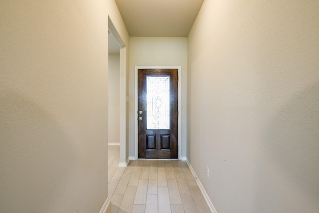 2103 Islawild Way, Texas City, TX 77568 - doorway to outside featuring light wood-style flooring and baseboards