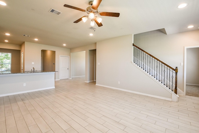 2103 Islawild Way, Texas City, TX 77568 - unfurnished living room with a ceiling fan, recessed lighting, baseboards, and stairs