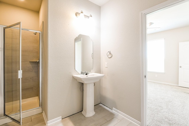 2103 Islawild Way, Texas City, TX 77568 - bathroom with a shower stall and baseboards