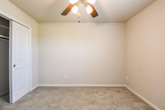 2103 Islawild Way, Texas City, TX 77568 - unfurnished bedroom featuring light carpet, baseboards, a closet, and a ceiling fan