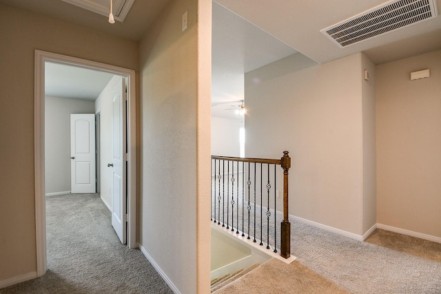 2103 Islawild Way, Texas City, TX 77568 - corridor featuring carpet, attic access, an upstairs landing, and baseboards