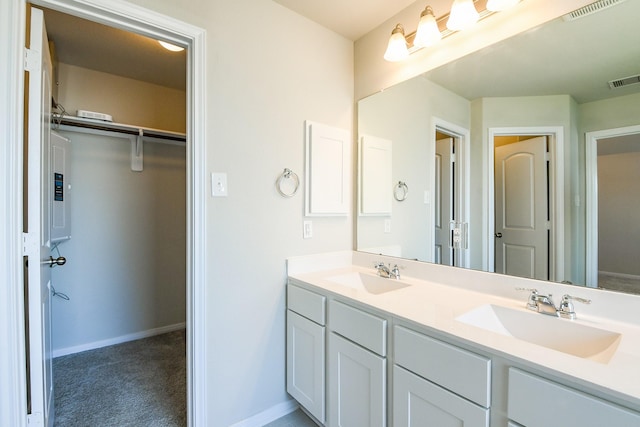 2103 Islawild Way, Texas City, TX 77568 - full bath with double vanity, baseboards, electric panel, and a spacious closet