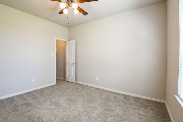 2103 Islawild Way, Texas City, TX 77568 - empty room featuring ceiling fan, light carpet, and baseboards