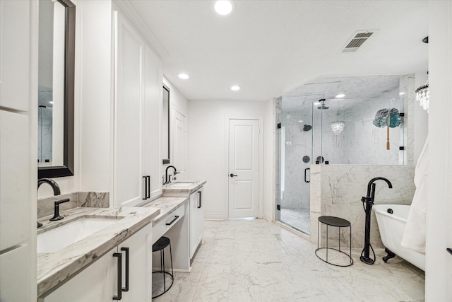 bathroom with recessed lighting, marble finish floor, visible vents, a marble finish shower, and a sink