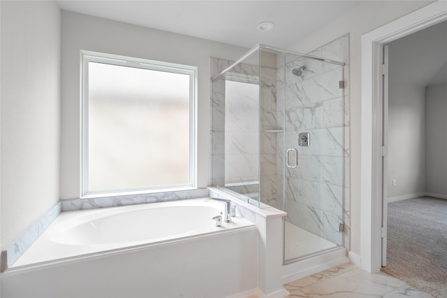 full bath with baseboards, a garden tub, marble finish floor, and a marble finish shower