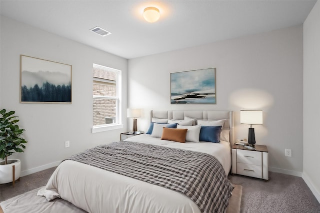 bedroom featuring visible vents, carpet flooring, and baseboards
