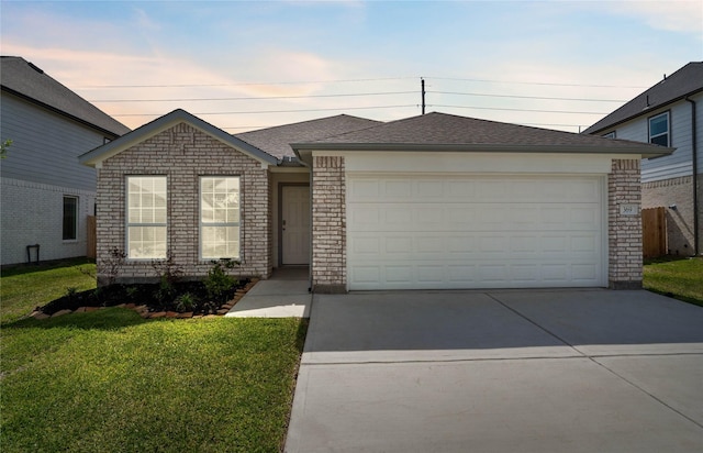 369 Spruce Oak Ln, Waller, TX 77484 - view of front of house with a front yard, driveway, brick siding, and a garage