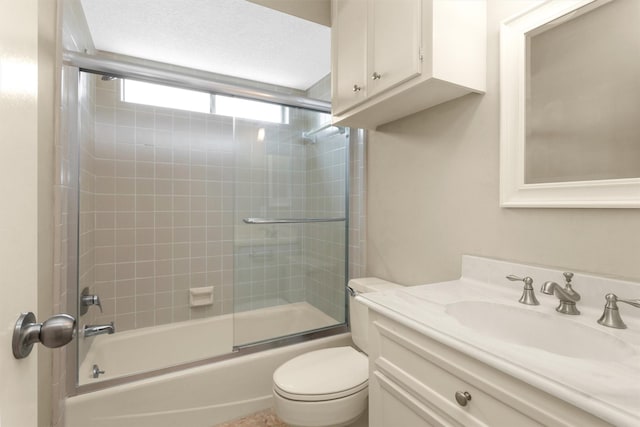 full bath with vanity, combined bath / shower with glass door, and toilet
