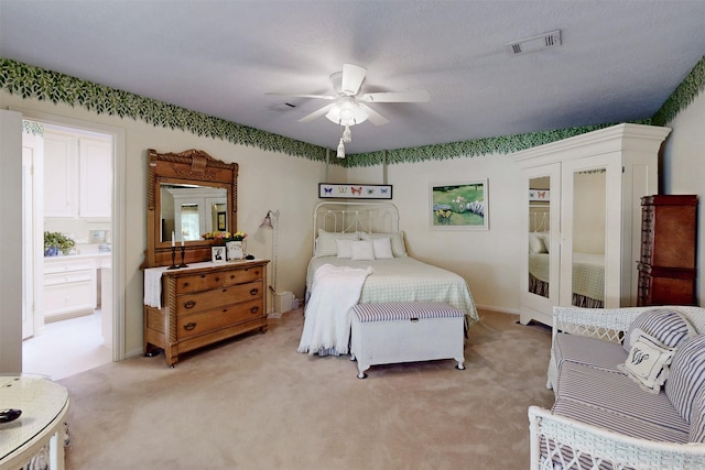 bedroom featuring ceiling fan, light carpet, and visible vents