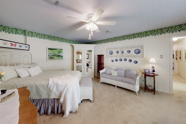 bedroom featuring ceiling fan, visible vents, baseboards, and light carpet