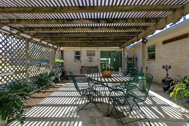 view of patio with a pergola and outdoor dining space