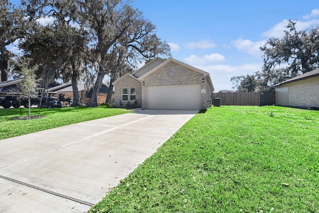 view of front of home with concrete driveway, a front lawn, an attached garage, fence, and brick siding