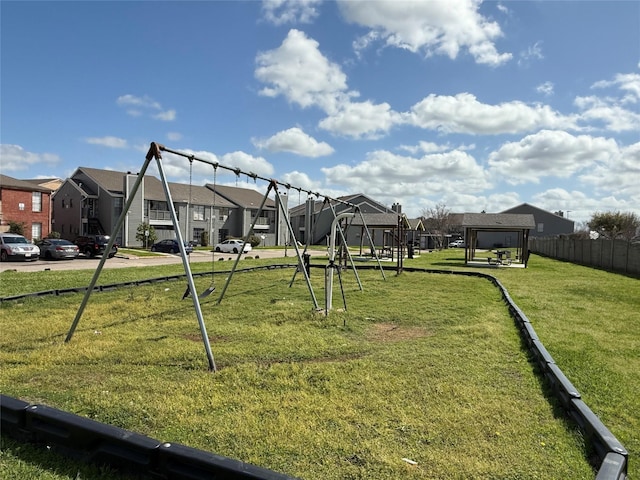 view of yard featuring fence and a residential view
