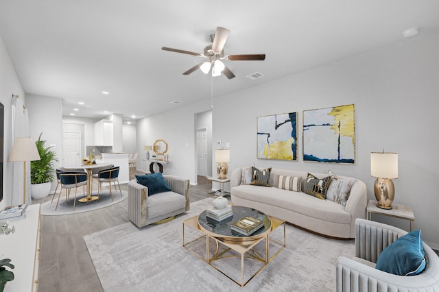 24709 Stablewood Forest Ct, Huffman, TX 77336 - living room with ceiling fan, light wood-style flooring, recessed lighting, and baseboards