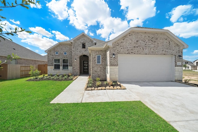 5319 Costa Ridge Ln, Katy, TX 77493 - view of front of house featuring fence, an attached garage, driveway, brick siding, and a front yard