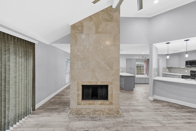 unfurnished living room featuring recessed lighting and baseboards