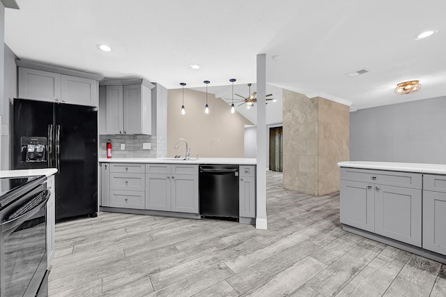 kitchen with dishwasher, black refrigerator with ice dispenser, gray cabinets, and a sink
