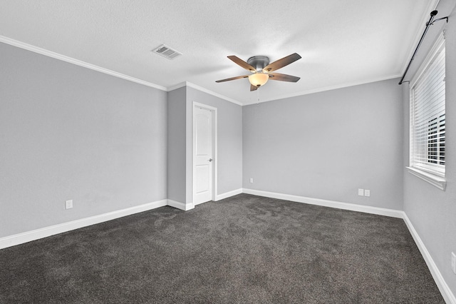 unfurnished room with dark carpet, baseboards, a ceiling fan, and visible vents