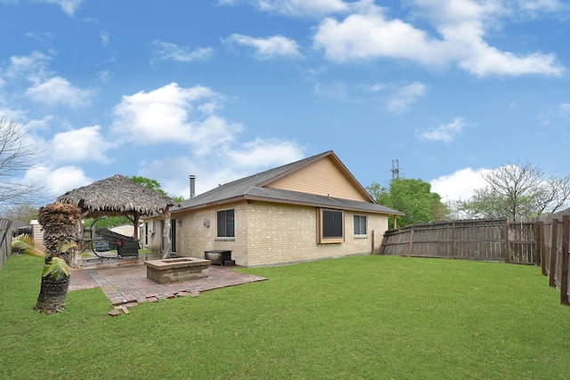 back of house with a patio area, a fenced backyard, a gazebo, and brick siding