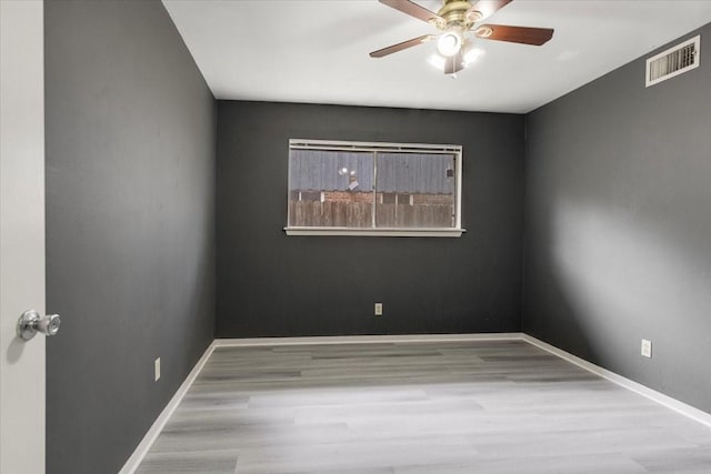 1330 Saxony Ln, Houston, TX 77058 - unfurnished room featuring wood finished floors, baseboards, a ceiling fan, and visible vents