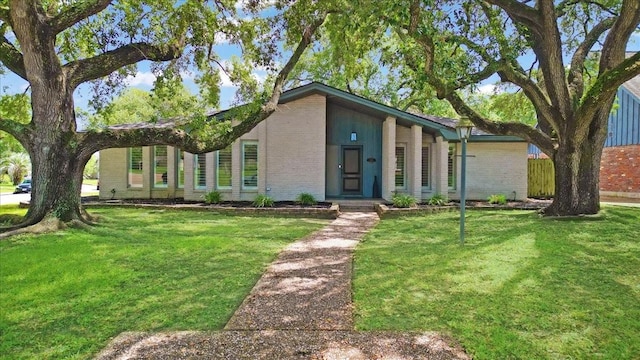 1330 Saxony Ln, Houston, TX 77058 - mid-century inspired home featuring brick siding and a front yard