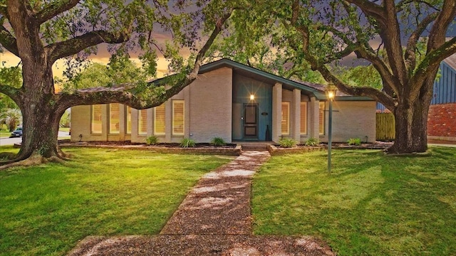 1330 Saxony Ln, Houston, TX 77058 - mid-century home featuring brick siding and a front lawn
