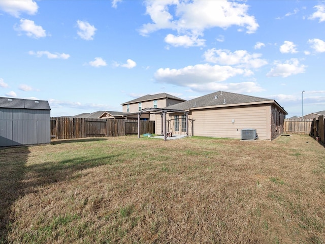 20819 Mount Bauer Dr, Hockley, TX 77447 - view of yard featuring a pergola, a fenced backyard, an outbuilding, cooling unit, and a storage unit
