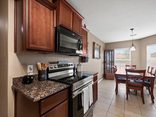 20819 Mount Bauer Dr, Hockley, TX 77447 - kitchen with baseboards, visible vents, stainless steel range with electric stovetop, black microwave, and light tile patterned floors