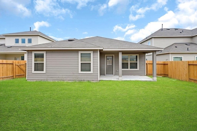 26400 Cooperstown Way, Splendora, TX 77372 - back of property with a fenced backyard, a patio area, and a lawn