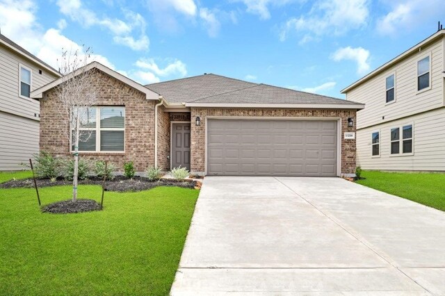 26400 Cooperstown Way, Splendora, TX 77372 - single story home with roof with shingles, a front lawn, driveway, brick siding, and a garage