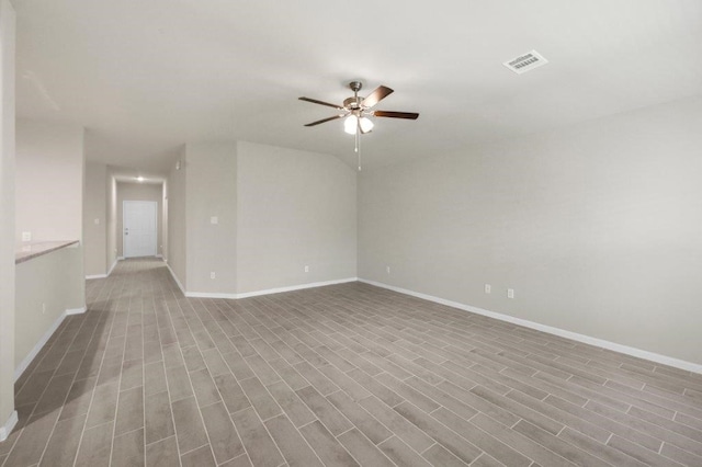 26400 Cooperstown Way, Splendora, TX 77372 - spare room with baseboards, a ceiling fan, wood finished floors, and visible vents